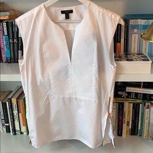 A crisp cotton white shirt with side zippers